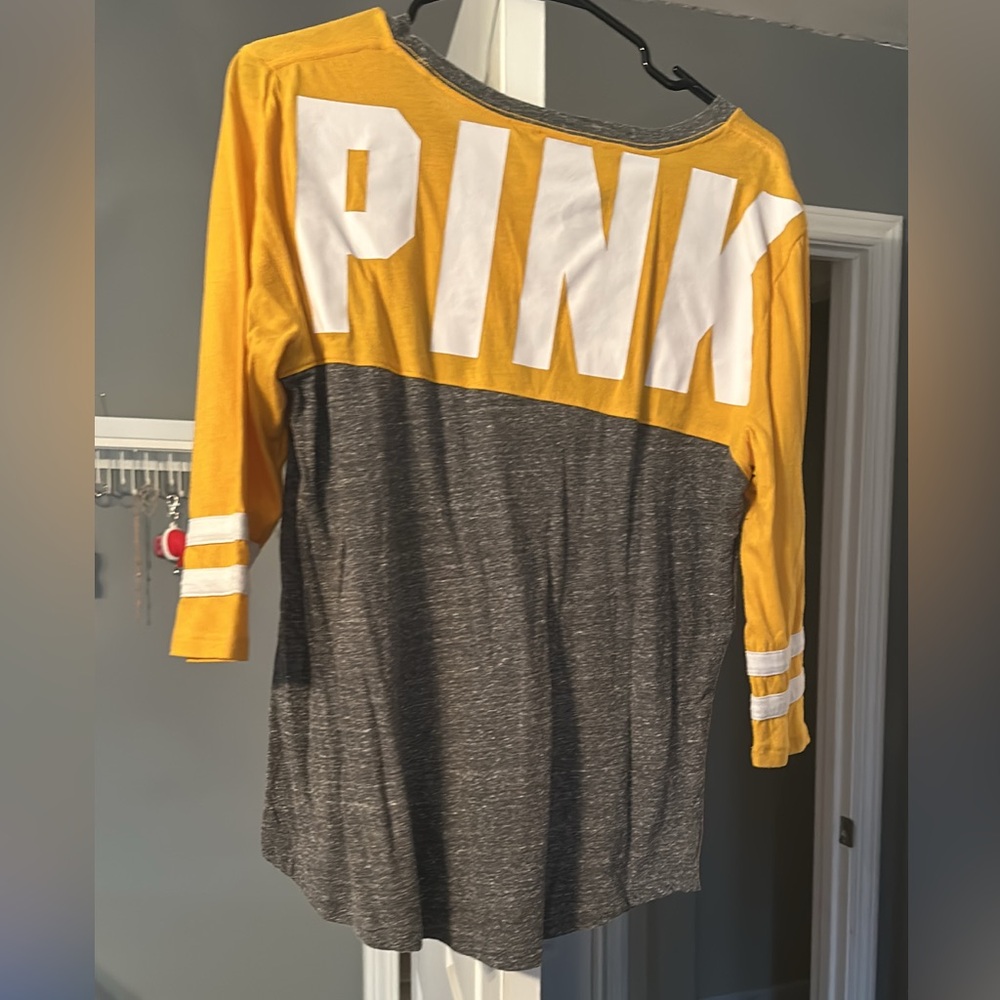 Size large Pink shirt. Worn once yellow and gray